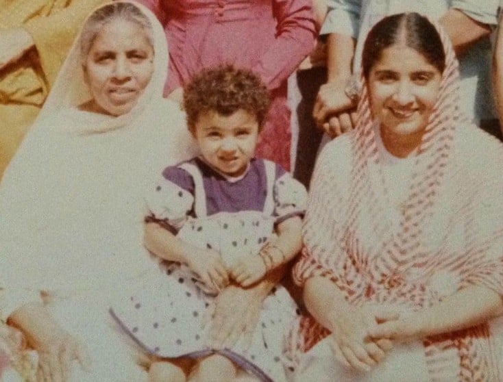 Desi~licious RD, Shahzadi Devje, dietitian, sitting on her grandma's lap as a little girl.