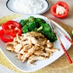 Ginger lime chicken with broccoli on a white plate