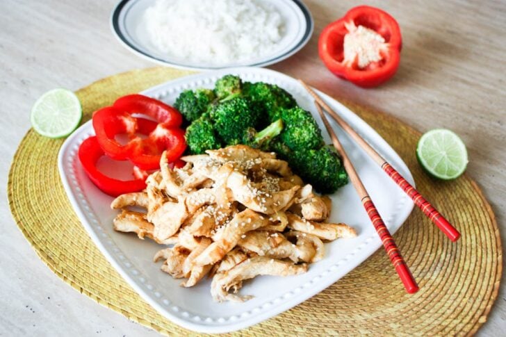 Ginger lime chicken with broccoli on a white plate