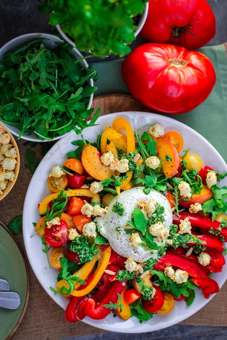 Sheet pan full of avocados, chickpeas, dips and bread