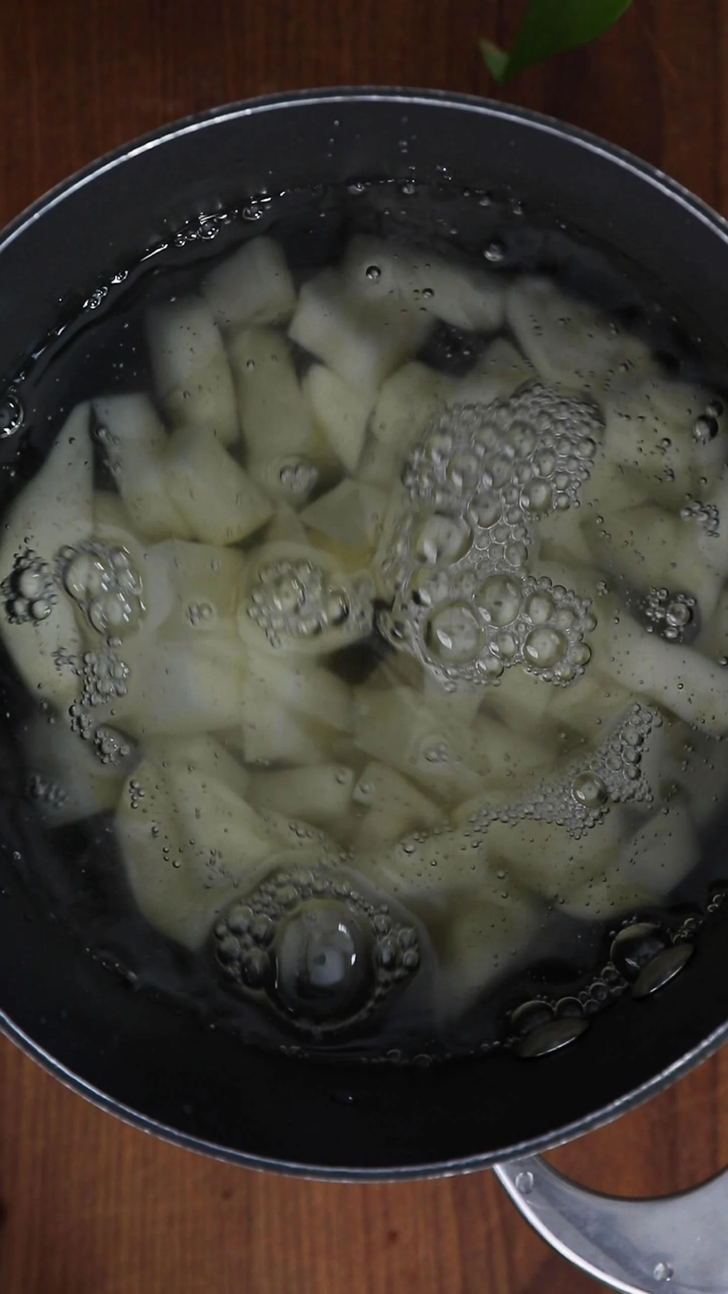 saucepan with cubes of potatoes and water.