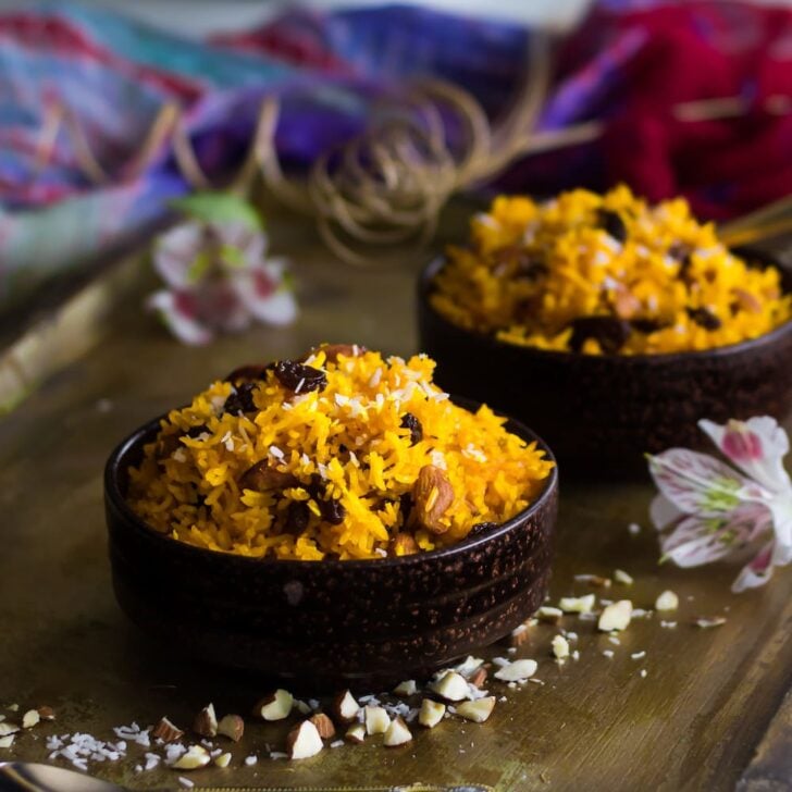 bowls of zarda (sweet rice) on a gold tray