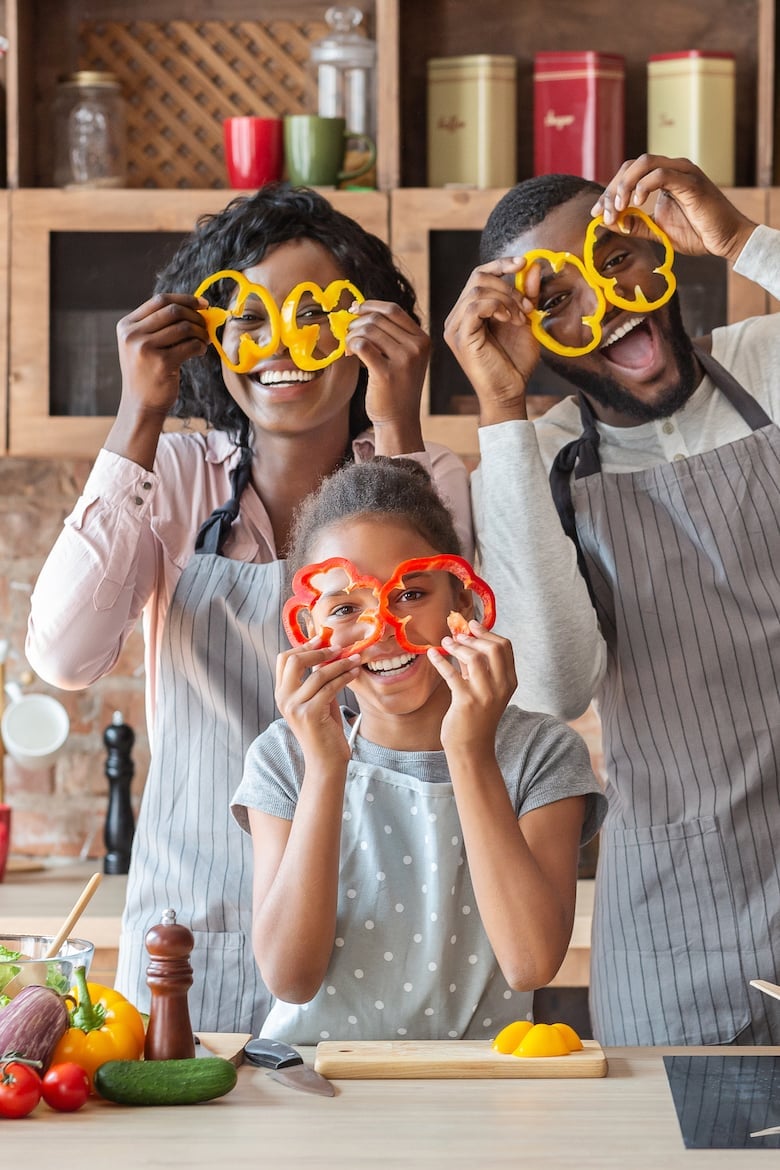 Kitchen Fun. Sweet African Family Having Fun While Cooking, wearing pepper glasses, copy space