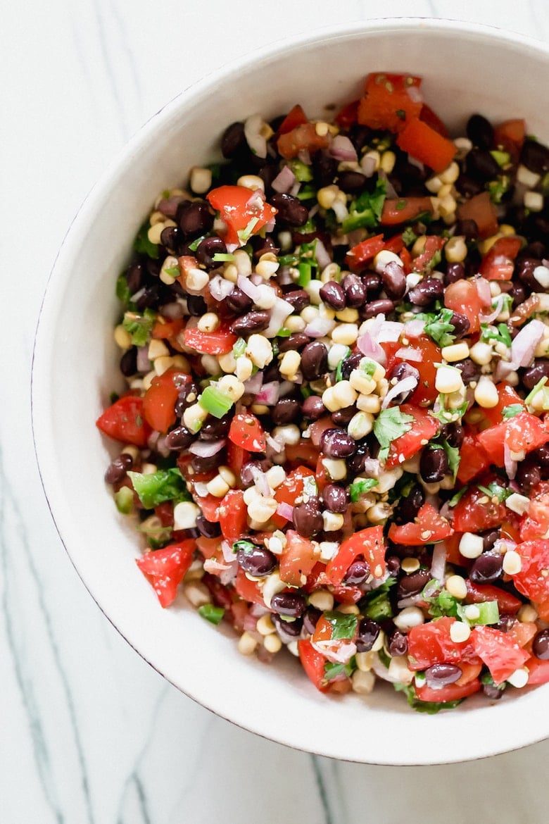 bowl of sweet corn and black bean salsa salad for a vegan BBQ recipe spread