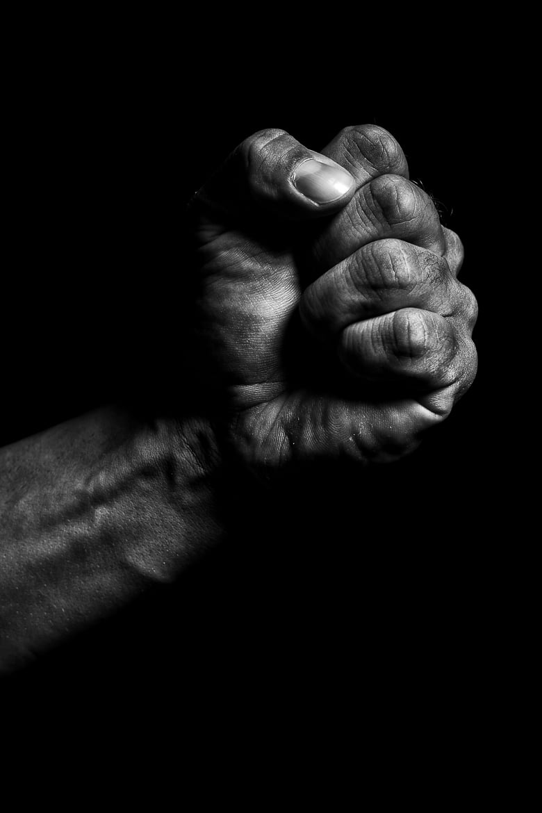 Clenched fist on a black background