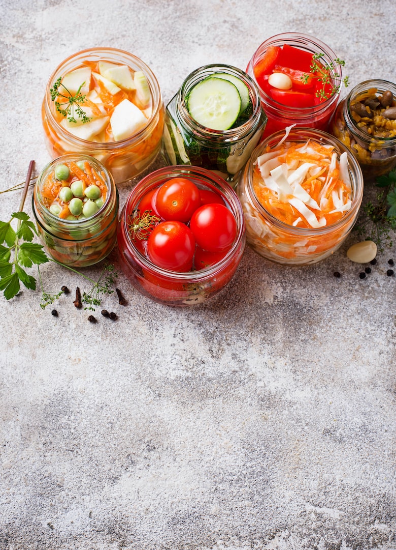 Fermented food. Preserved season vegetables in jars. Selective focus