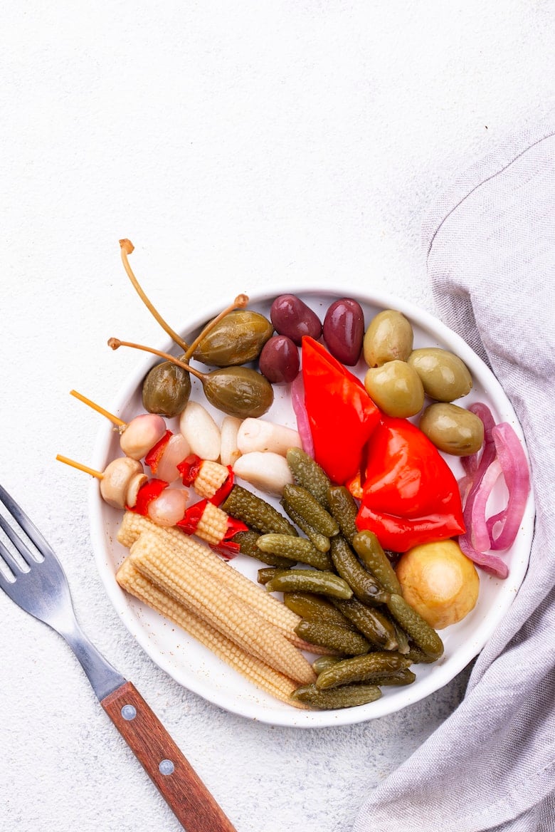 Assortment of pickled vegetables in plate. Fermented food concept