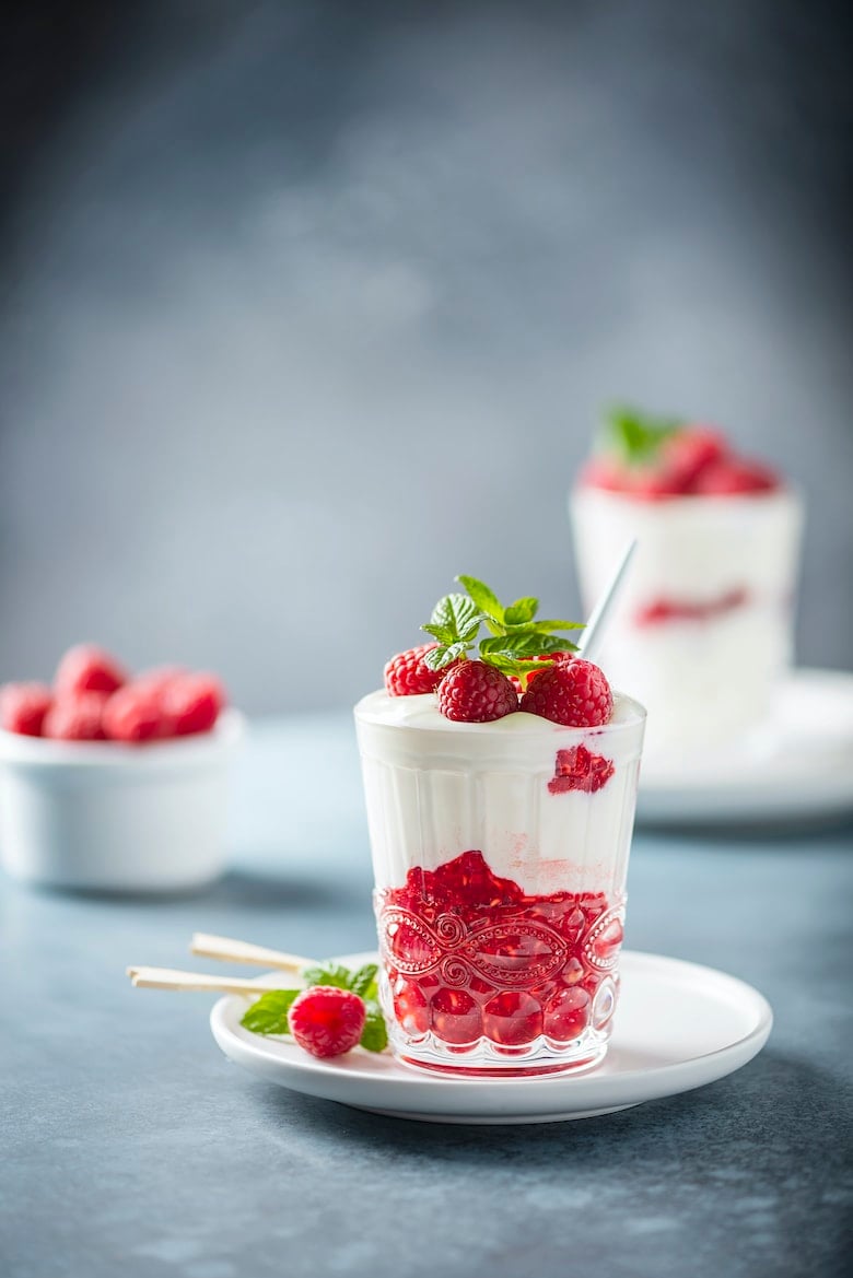 Healthy yogurt with raspberry and mint, selective focus image