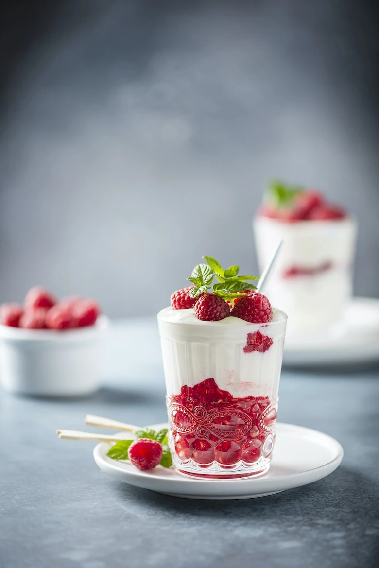 Healthy yogurt with raspberry and mint, selective focus image