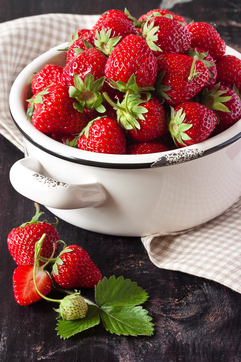 Sweet fresh strawberry in a white bowl.