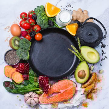 Balanced nutrition concept for clean eating diet. Assortment of healthy food, superfood ingredients for cooking on a kitchen table. Top view flat lay background, copy space