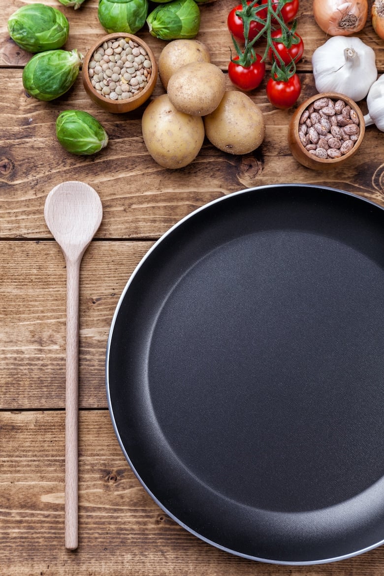 Fresh and healthy organic vegetables and food ingredients on wooden background