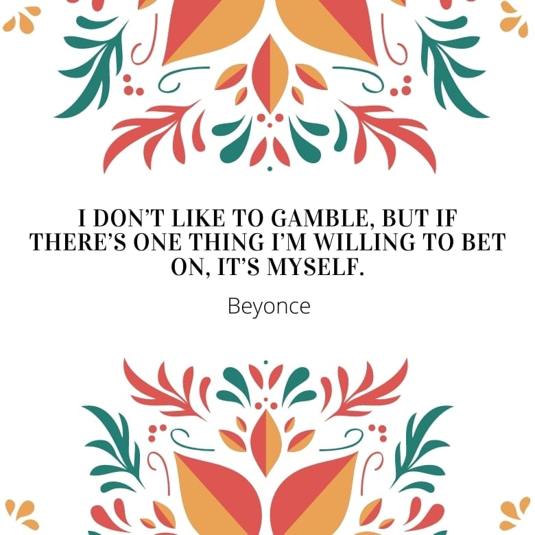 white graphic with red, green and orange ethnic design stems and leaves overlaid with a self love quote by Beyonce