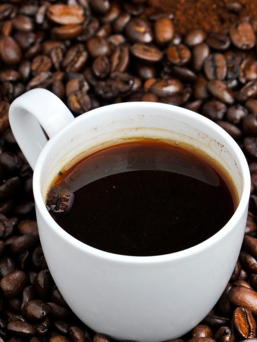 coffee. Coffee beans and cup of coffee. Close up view.