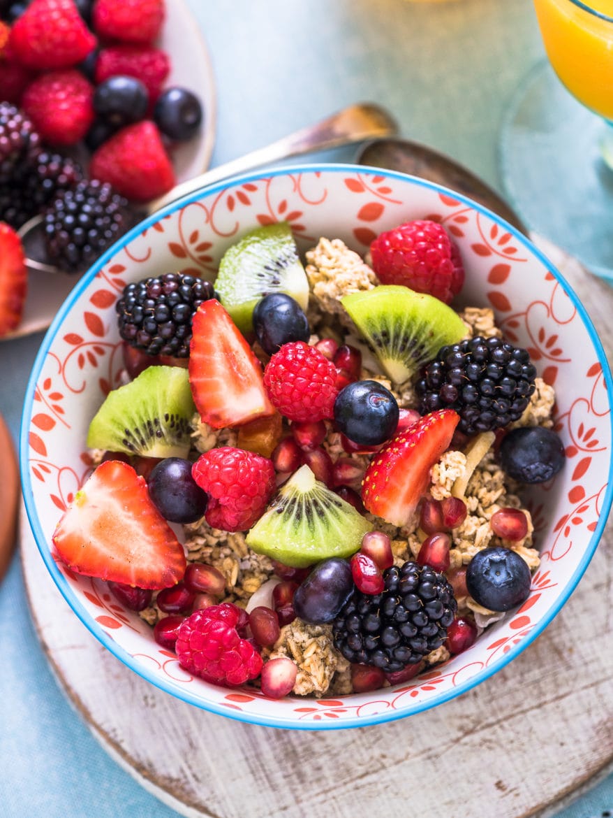 fresh fruits in breakfast bowl and honey as a natural way to fall asleep