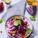 Healthy winter salad with red cabbage, carrot, beetroot, spinach, pomegranate, vitamin food