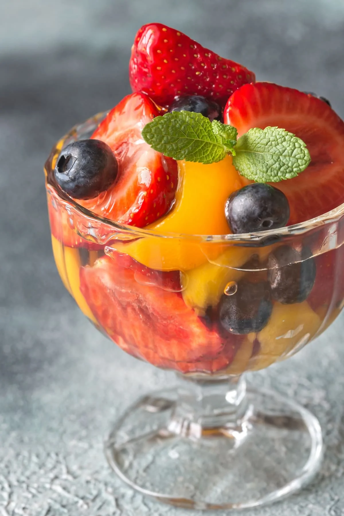 Fruit salad in the glass vase.