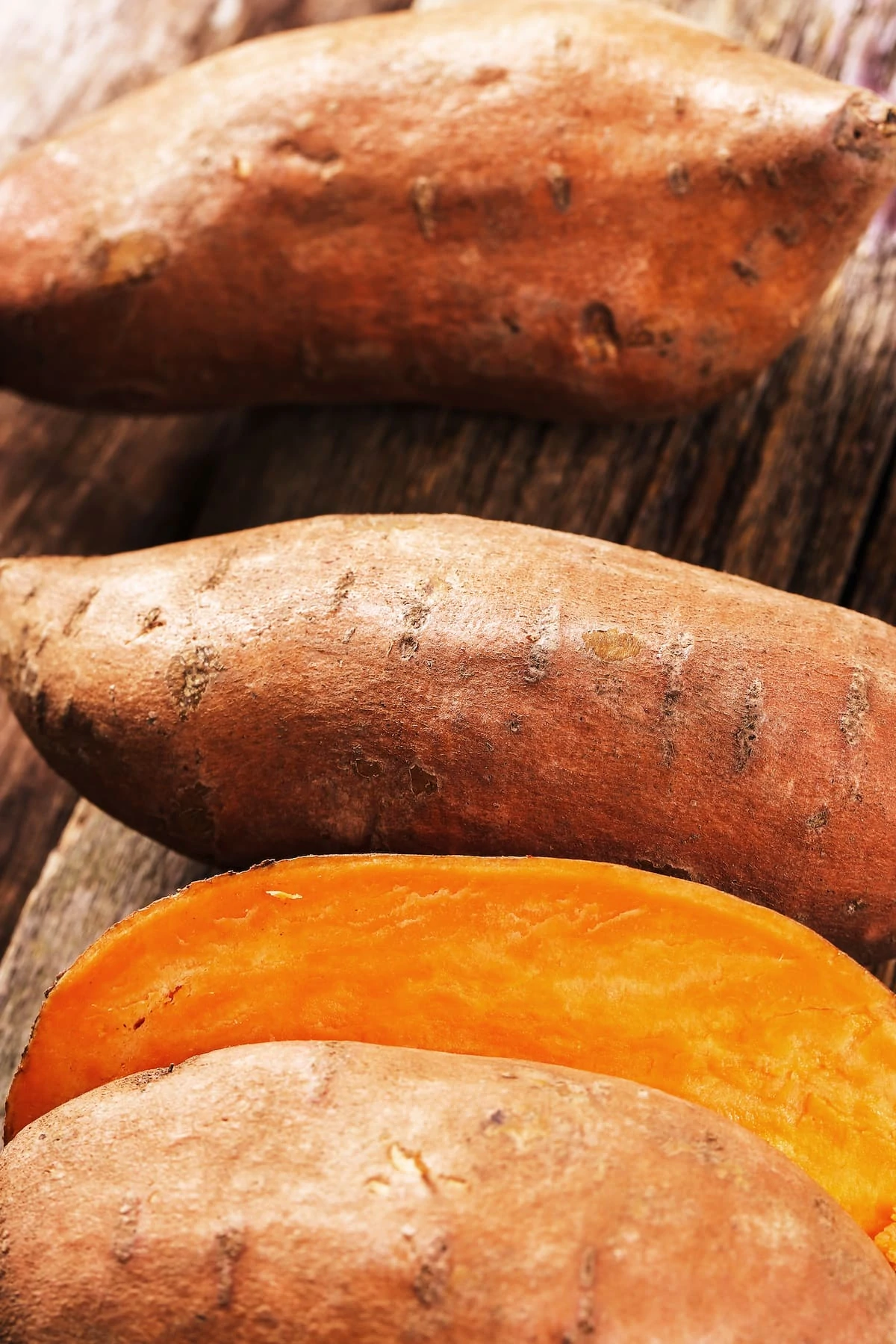 Sweet potato on the wooden table.