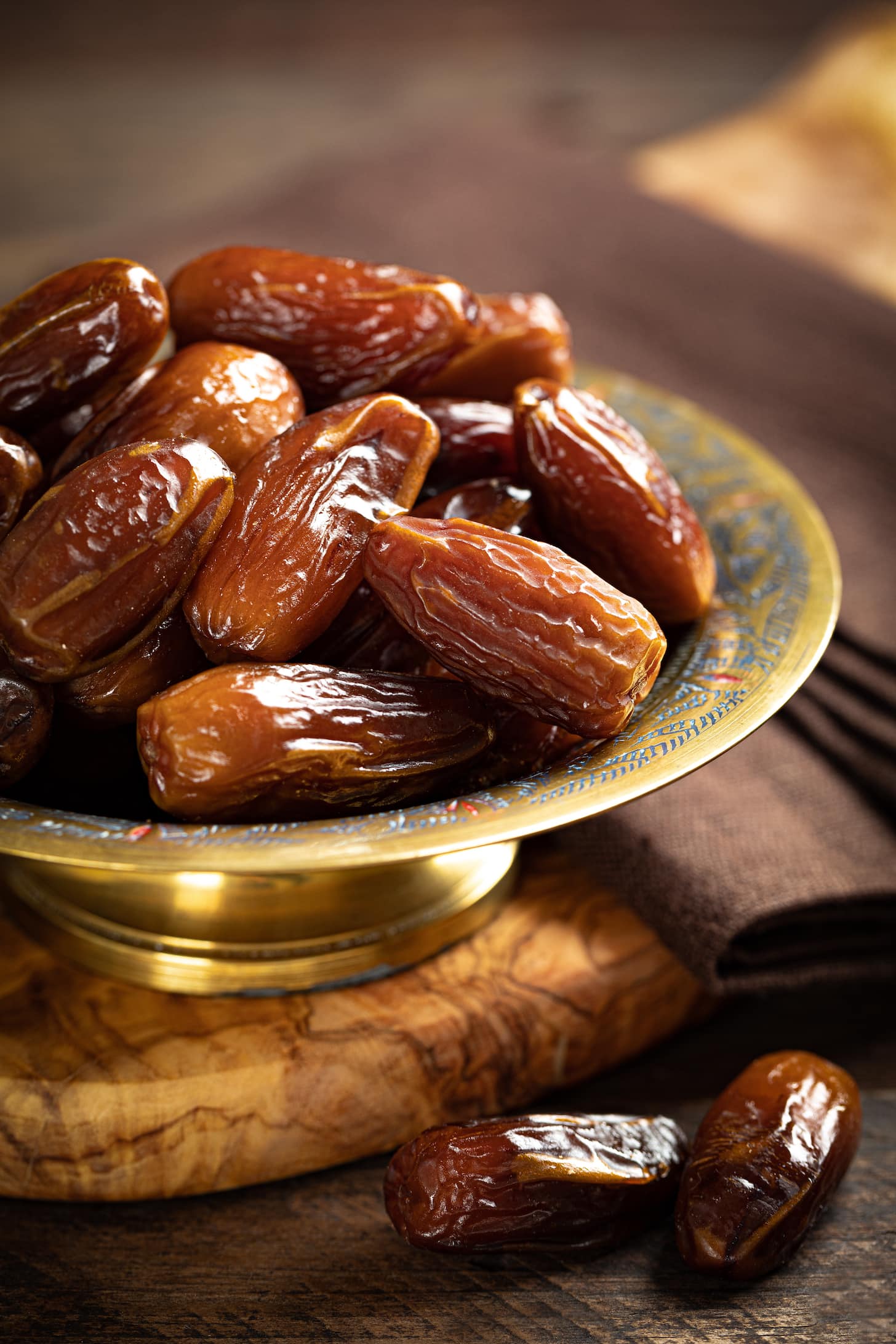 Dried dates on a golden plate