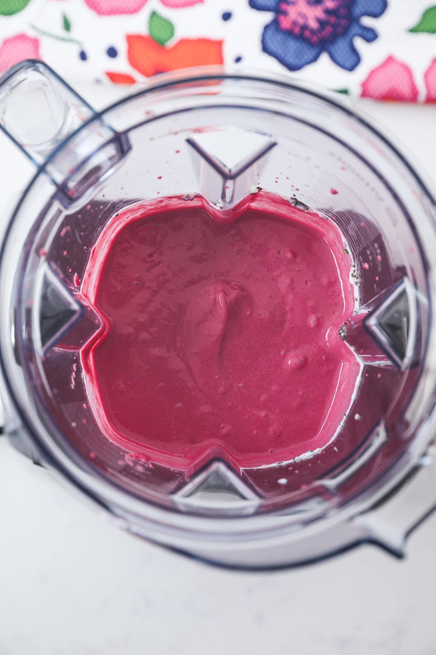 birds-eye view of a pink smoothie in a blender.