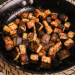 pan of charred tofu cubes