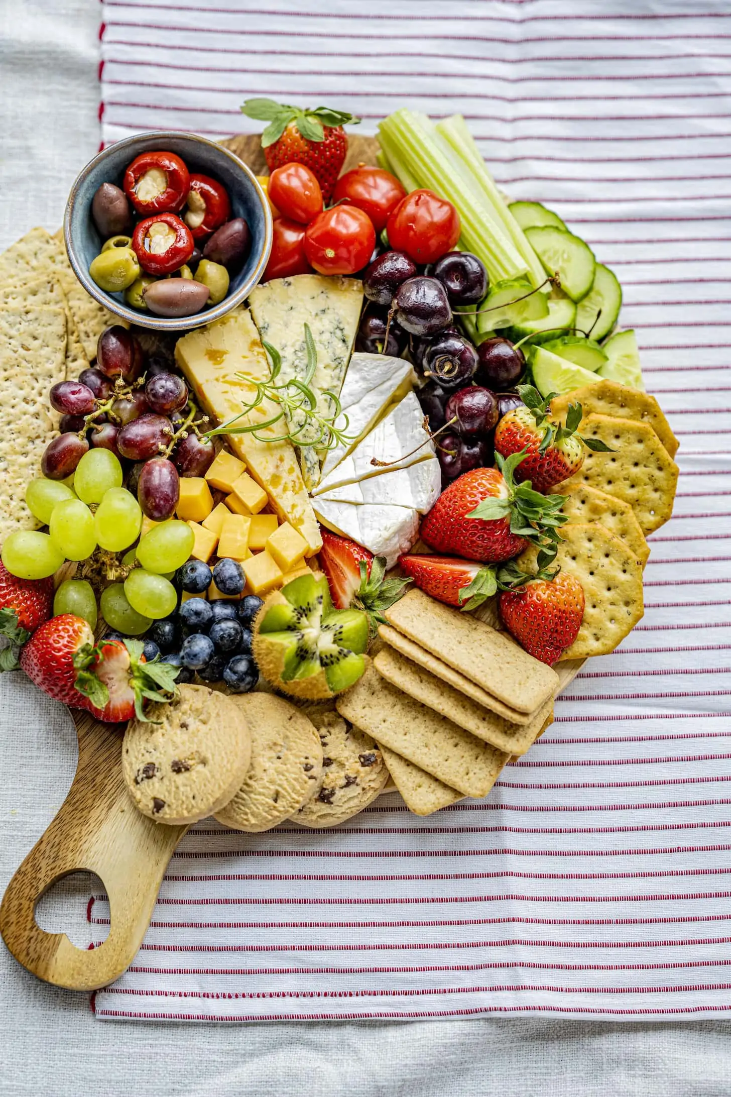 Cheese board with fresh fruits and crackers