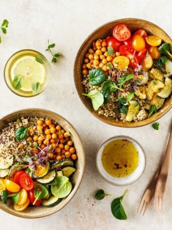 Quinoa, chickpeas and vegetables bowls. Healthy vegan lunch bowls. Food background with copy space. Top view.