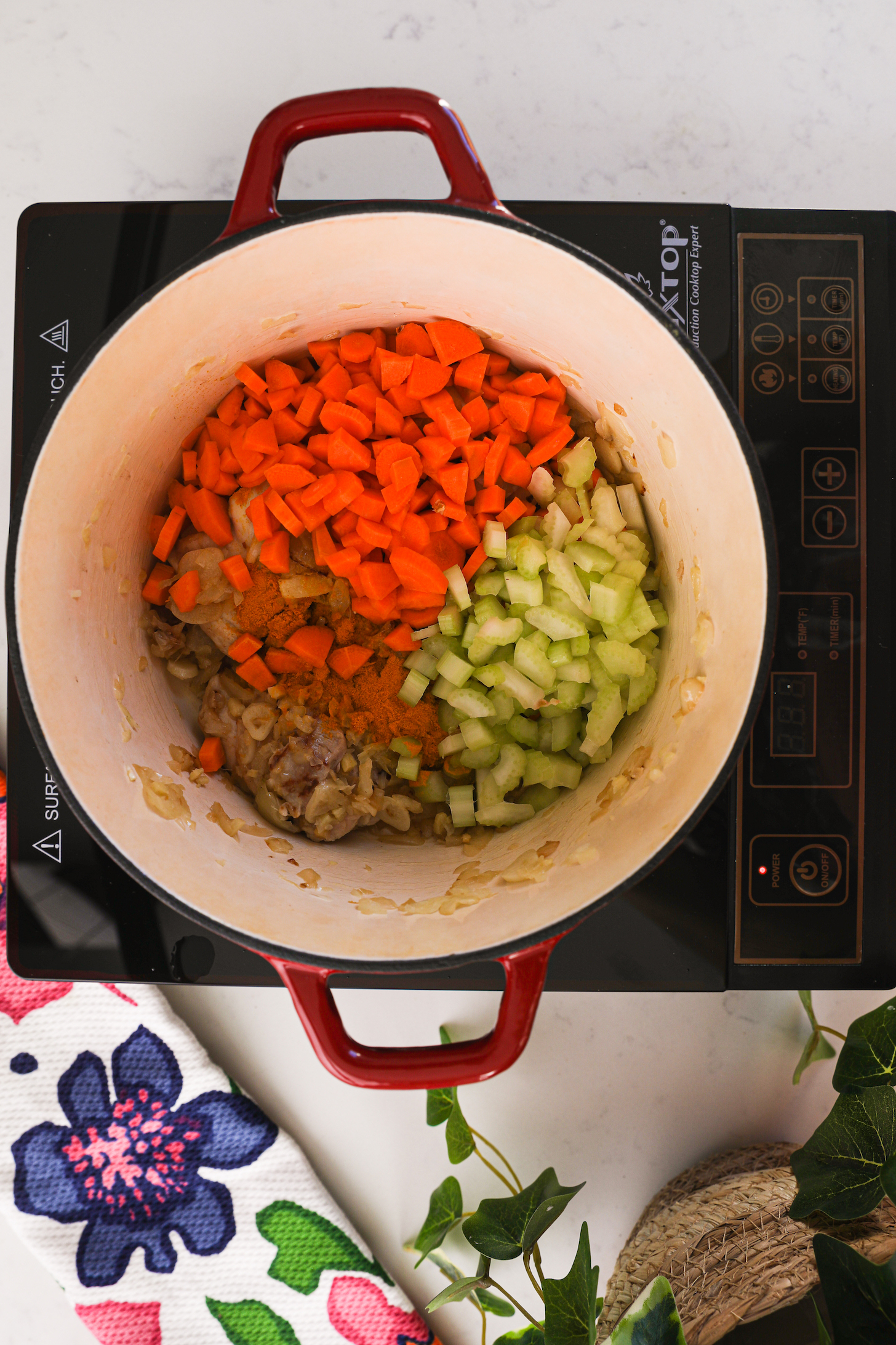 Overhead shot of a cooking pot with vegetables in it.