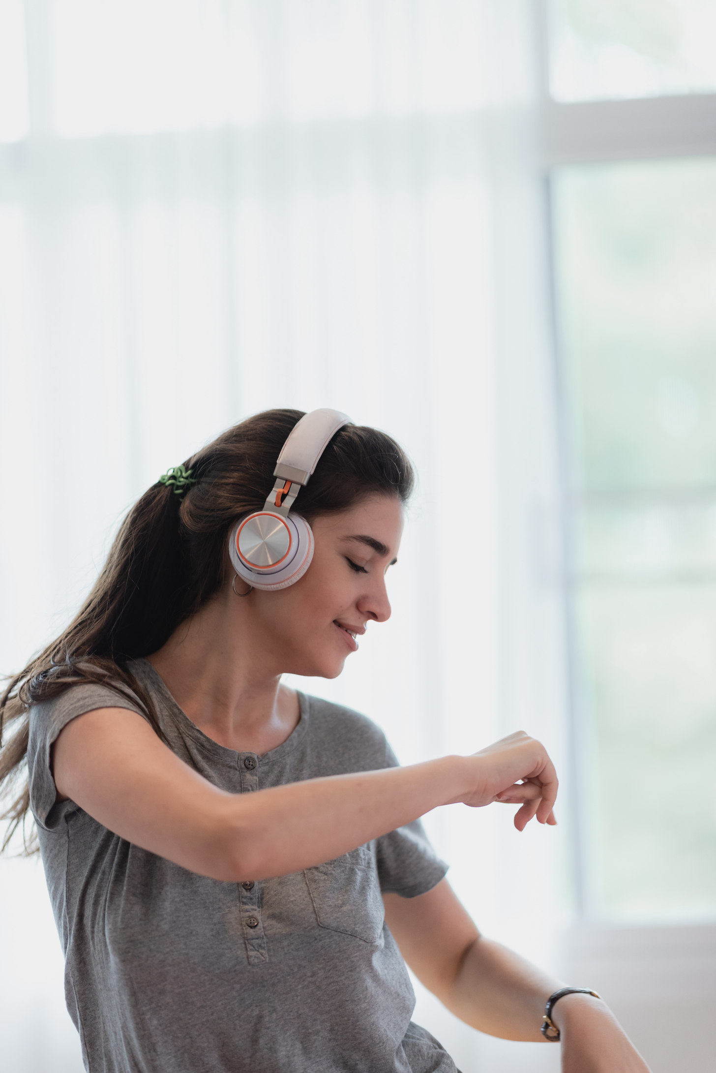 young pretty woman person are happy and enjoy with music by using earphone for listen a sound audio in bedroom at home, relax and fun lifestyle with a song melody, house entertainment headset concept