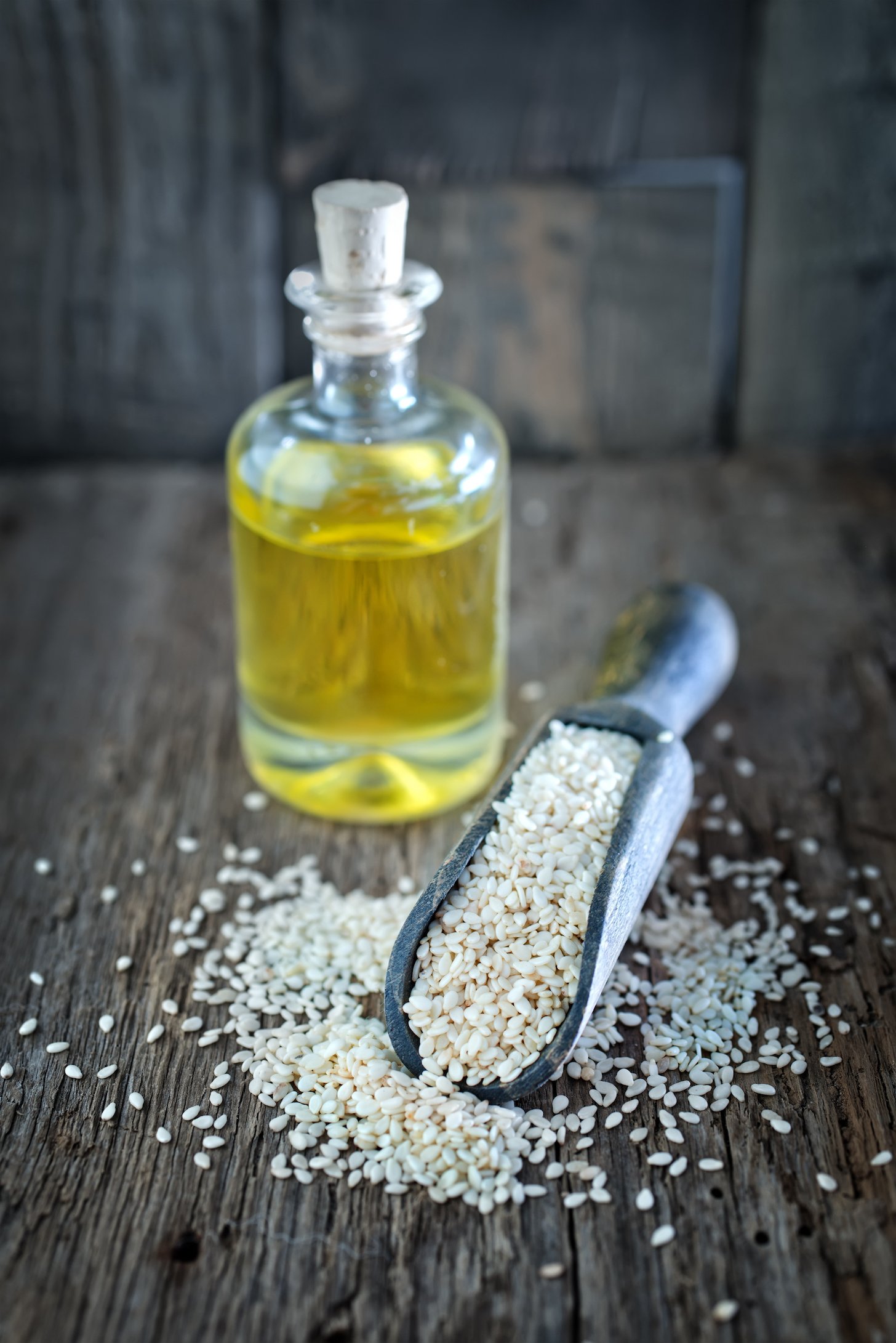 sesame oil in bottle and on a table