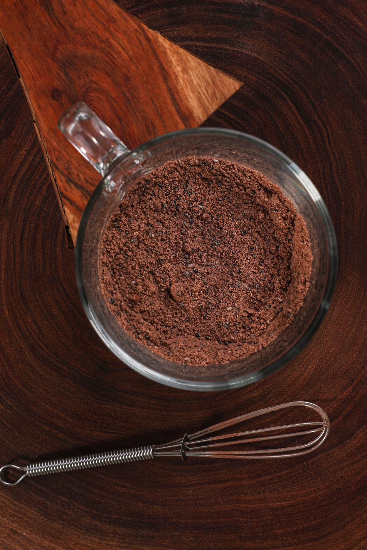 A mug with a chocolate-coloured powder.