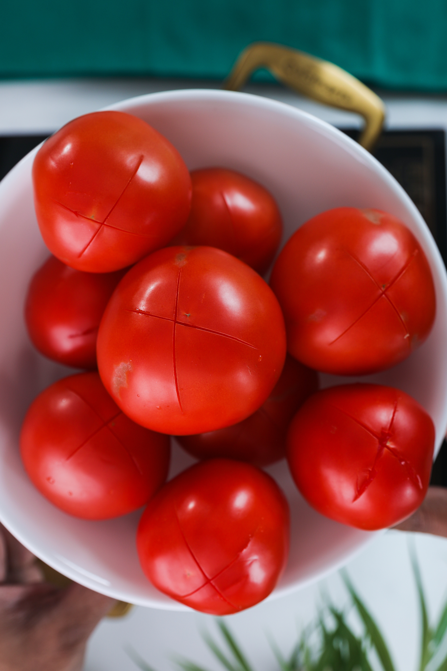Slited tomatoes in a bowl.