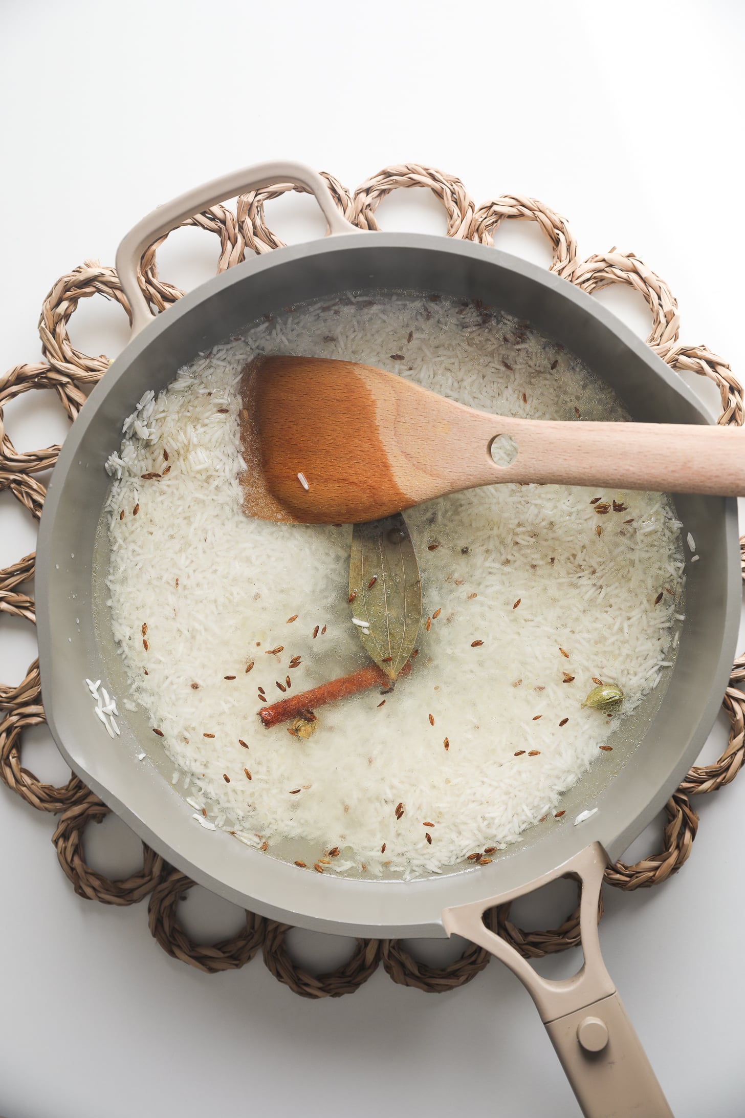 Rice simmering in seasoned water.